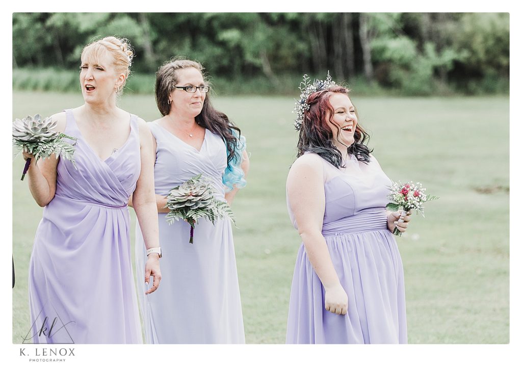 Candid photo of the Bridesmaid laughing on a wedding day at the Shattuck Golf Club in jaffrey NH. 