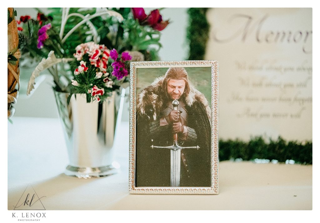 Memorial Table with a picture of Ned Stark from the Game of Thrones. for this GOT themed wedding