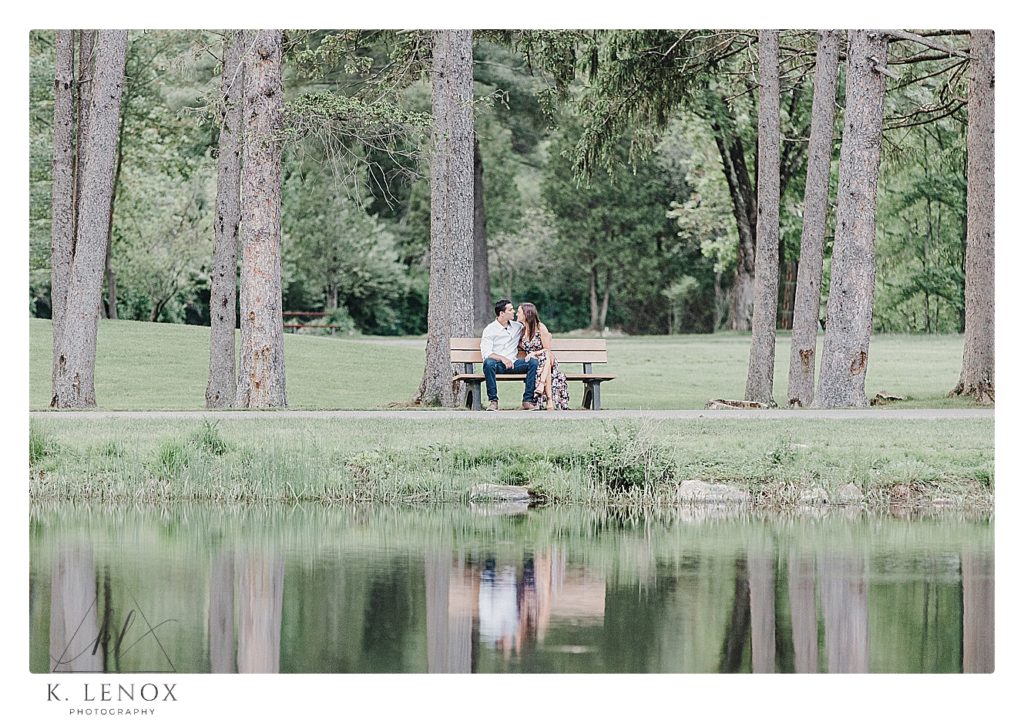 Light and Airy candid photo of an engaged couple in Benson Park in NH.  Photo by K. Lenox Photography