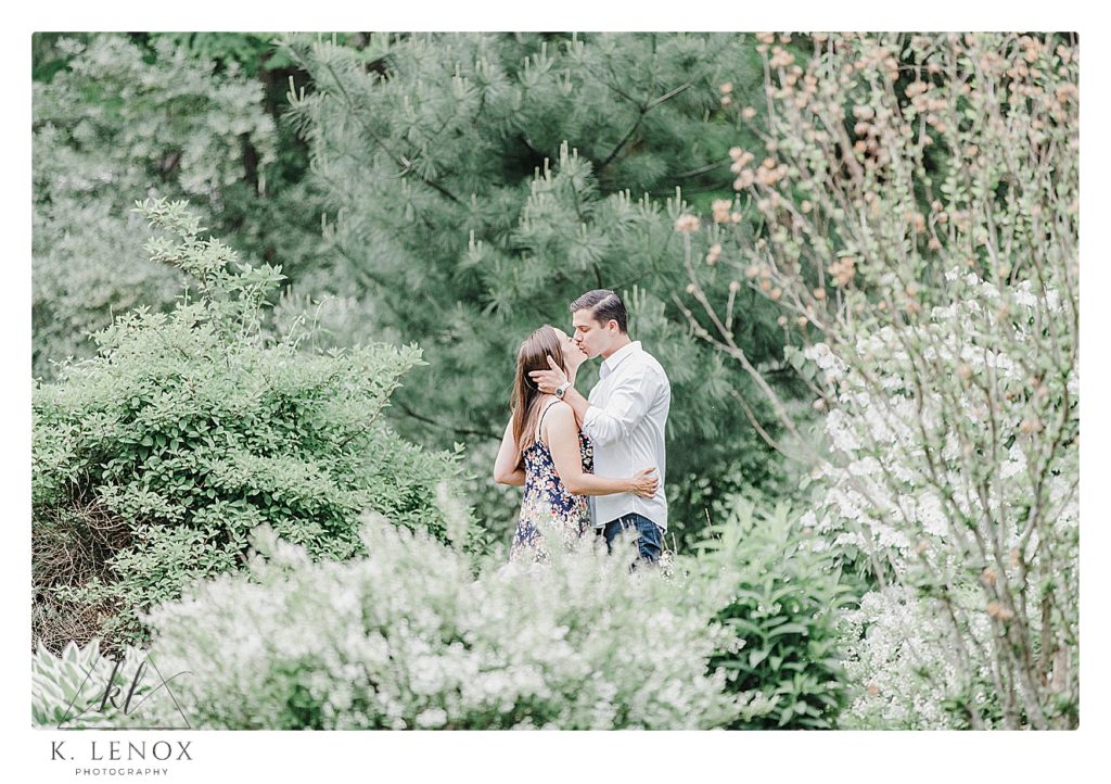 Light and Airy candid photo of an engaged couple in Benson Park in NH.  Photo by K. Lenox Photography