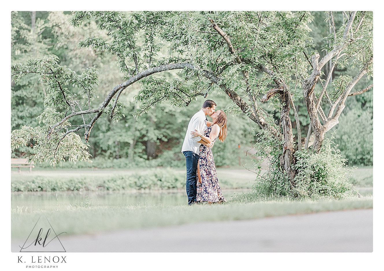Light and Airy candid photo of an engaged couple in Benson Park in NH. Photo by K. Lenox Photography