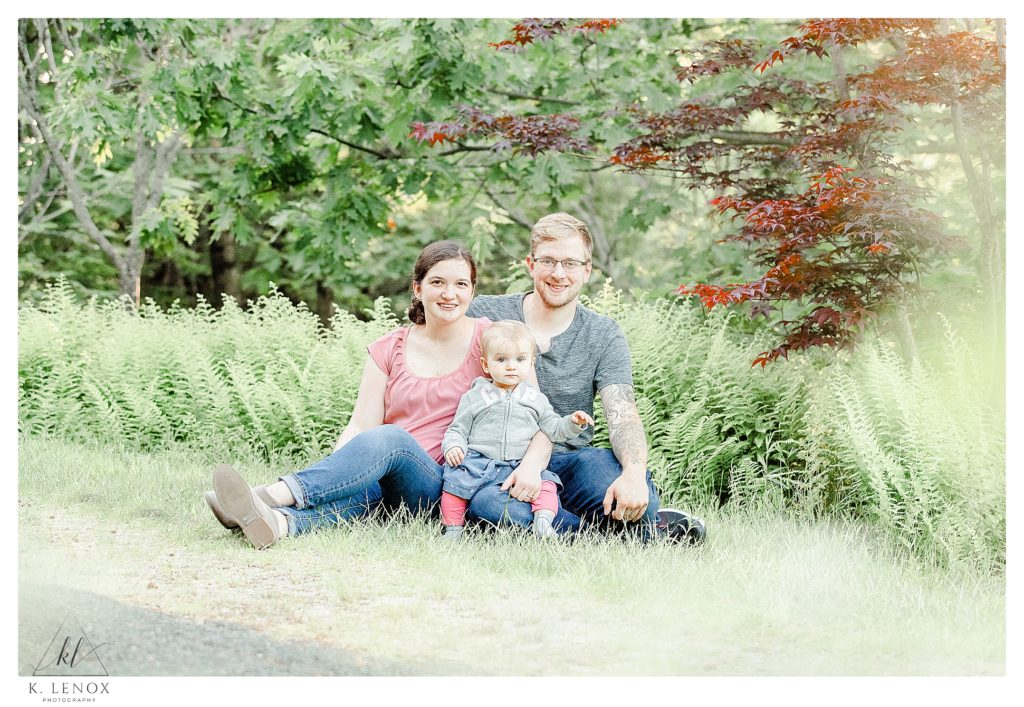 Light and Airy Family Photo taken during an engagement session at Cathedral of the Pines.  Showing a family of three. 