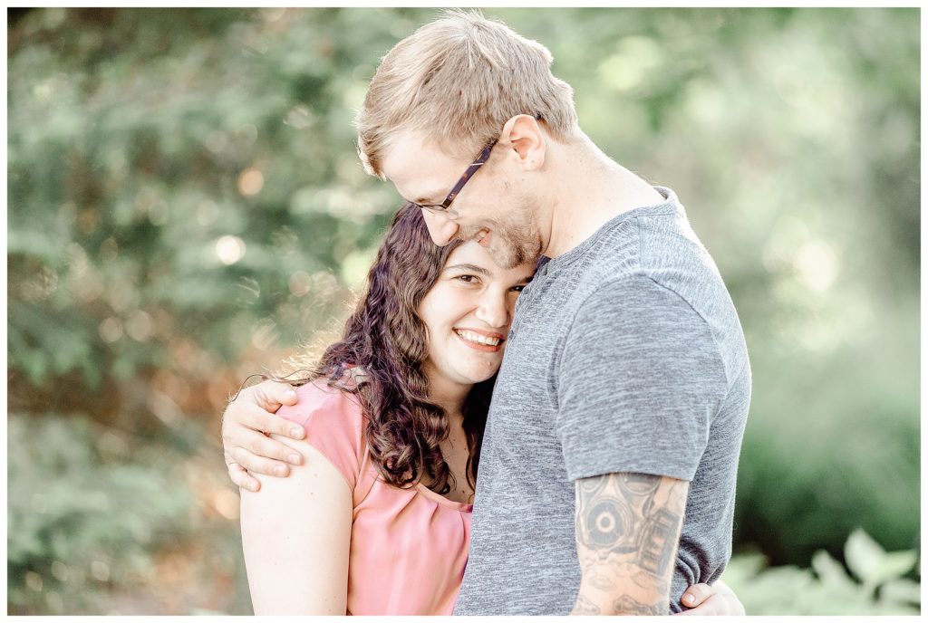 Man and Woman hug during their light and airy engagement session with K. Lenox Photography