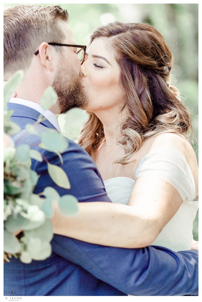 Bride and Groom Kiss on their wedding day.   Candid, Light and Airy photo taken by K. Lenox photography. 