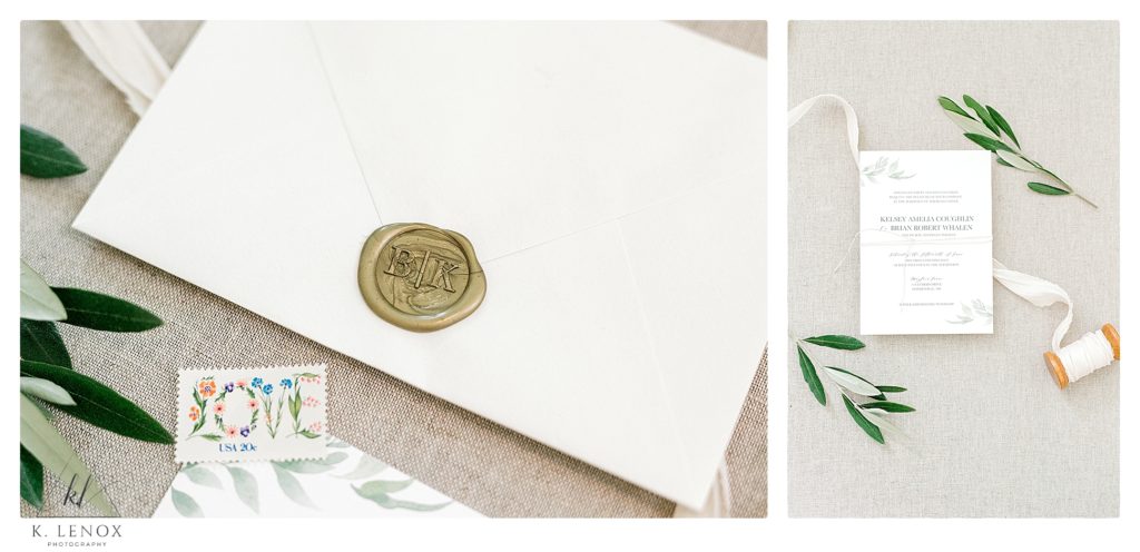 Goldish wax seal invitation envelope with a Love stamp.  Photographed with a grey background and Olive leaves. 