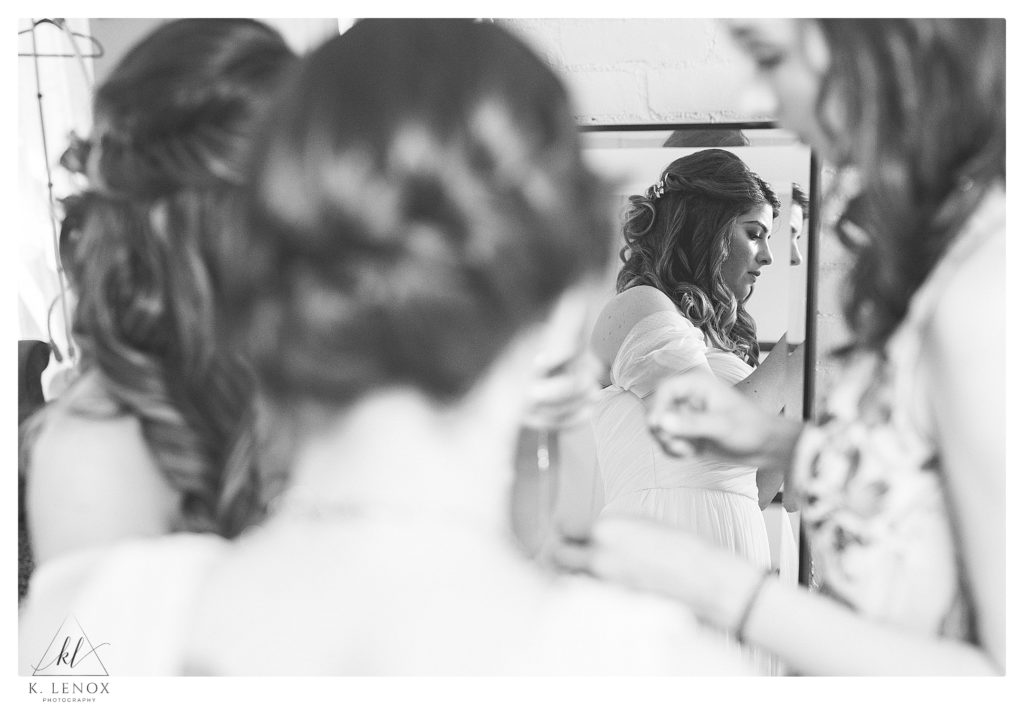 Black and White candid photo of a bride getting ready on her wedding day in Harrisville NH. 