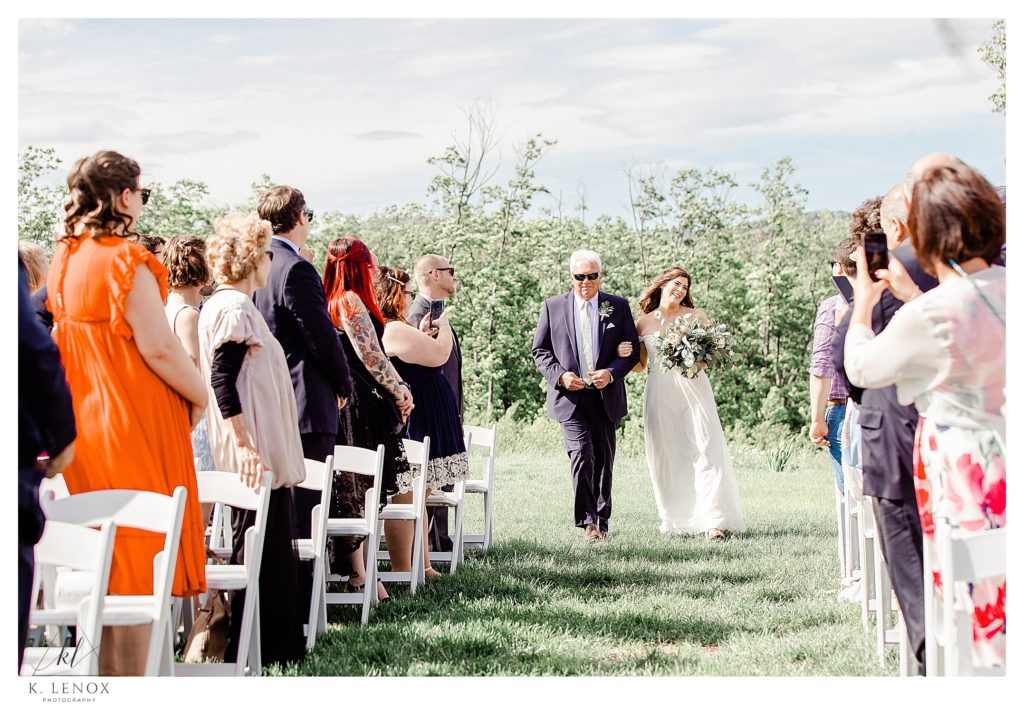 Bride and her dad walk down the aisle at her Mayfair Farm Wedding