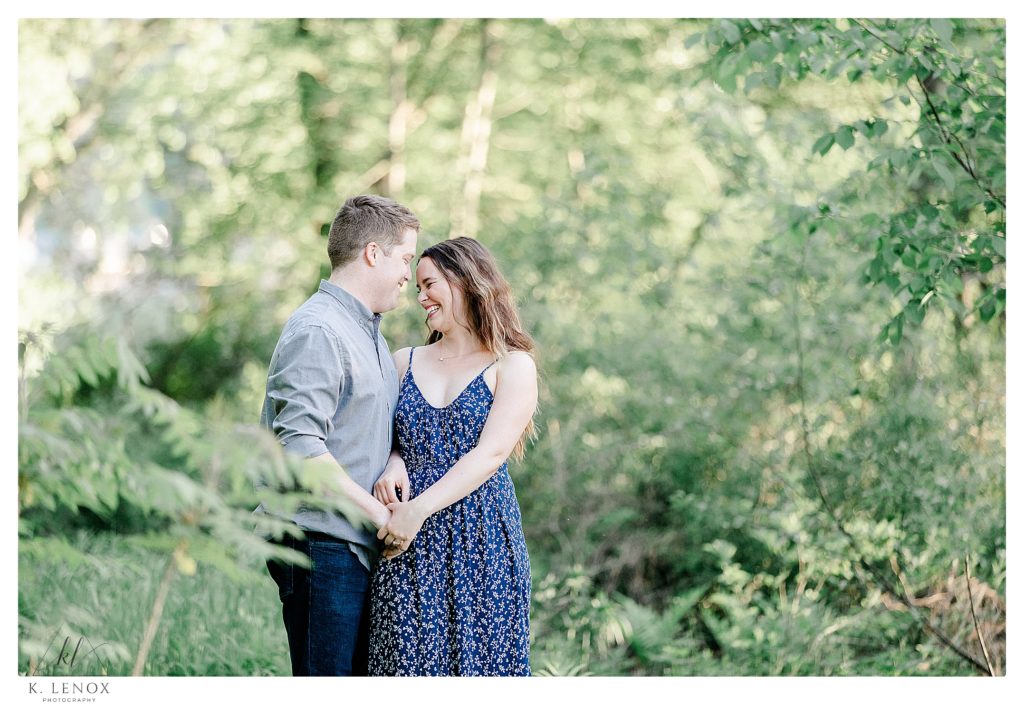 Man and Woman hold hands during their Outdoor Engagement Session in Brattleboro VT