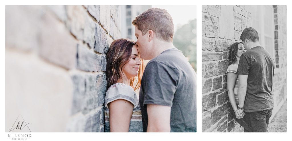 Engaged couple next to a Stone wall during their engagement session. 