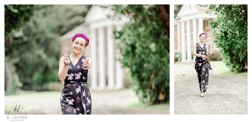 Badass senior portraits with a girl wearing a black, floral jumpsuit and has purple hair. 