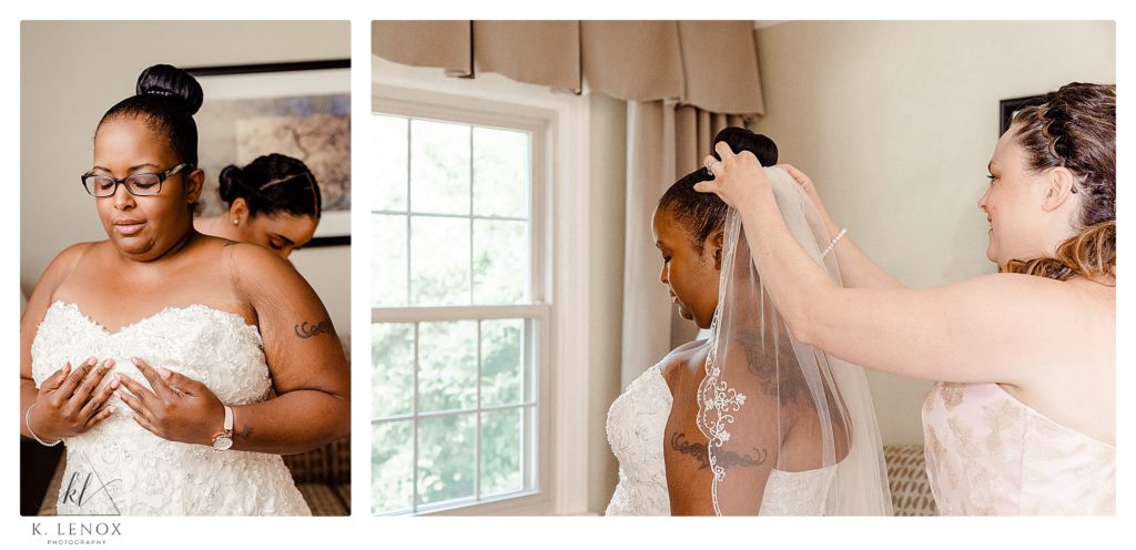 Bride is getting dressed with the help of her bridesmaids.  
