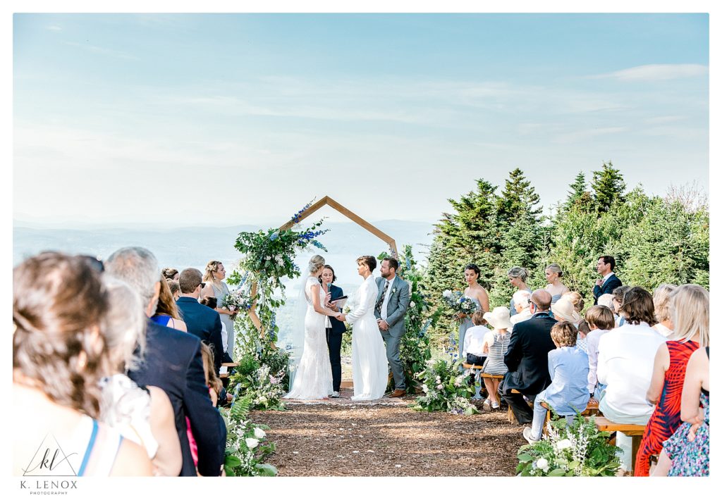 Summer wedding at Mount Sunapee with two brides at the summit. 