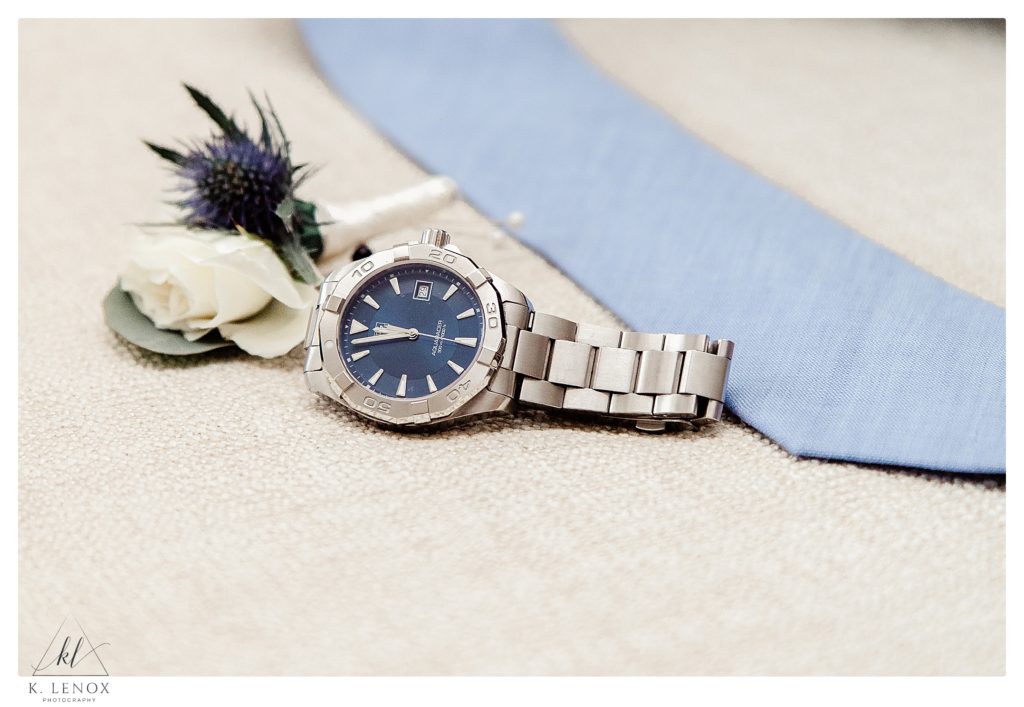 Watch and a Grooms blue tie, and boutonniere 