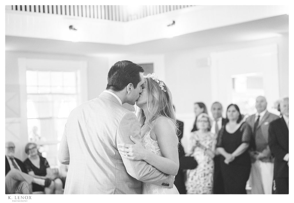 Black and White photo of a bride and groom kissing during their first dance at Wedding at the York Golf and Tennis Club. 