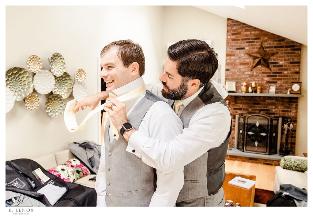Groom and his brother getting ready for the summer wedding at Birch wood Vineyards. 