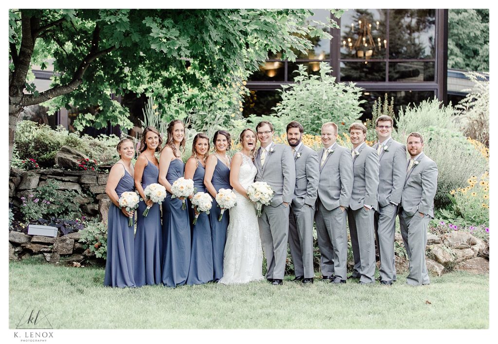 Light and Airy photo of a Bride and Groom with their entire wedding party at Birch Wood Vineyards. 
