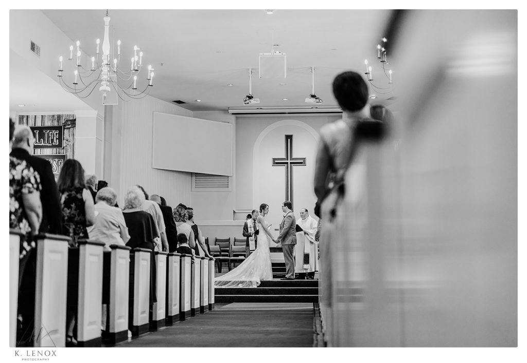 Summer Wedding at the Bethany Covenant Church in Bedford NH.  Black and White photo of the ceremony. 