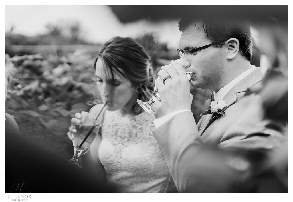 Candid Black and White photo of a Bride and Groom during their Summer Wedding at Birch Wood Vineyard. 