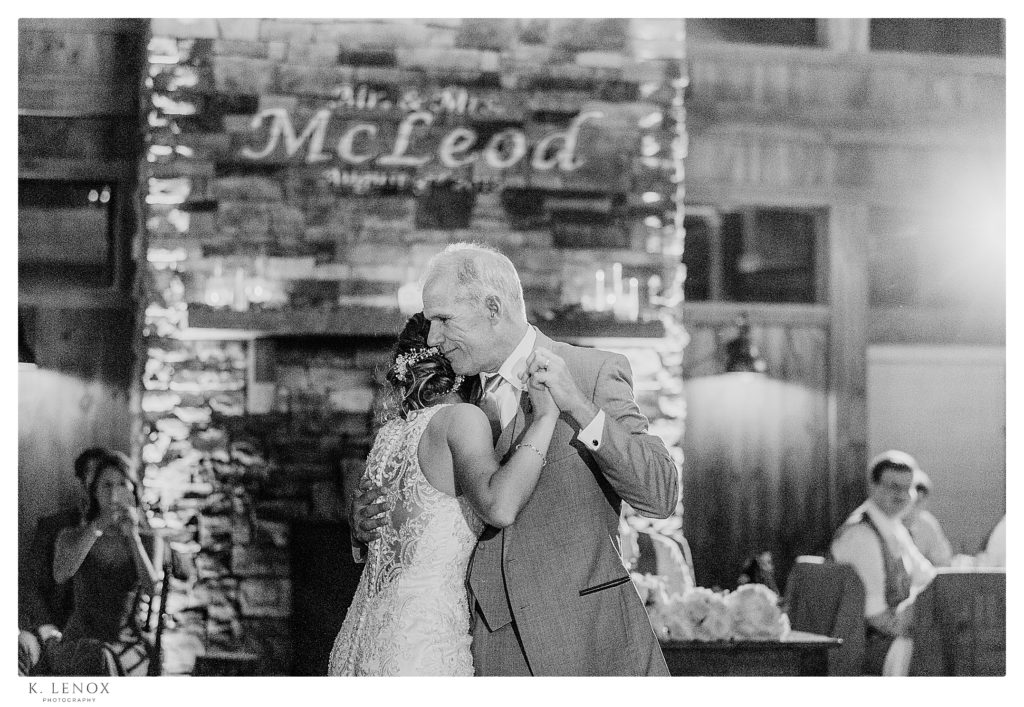Bride dances with her dad during their Summer Wedding Reception at the Birch Wood Vineyard in Bedford NH.