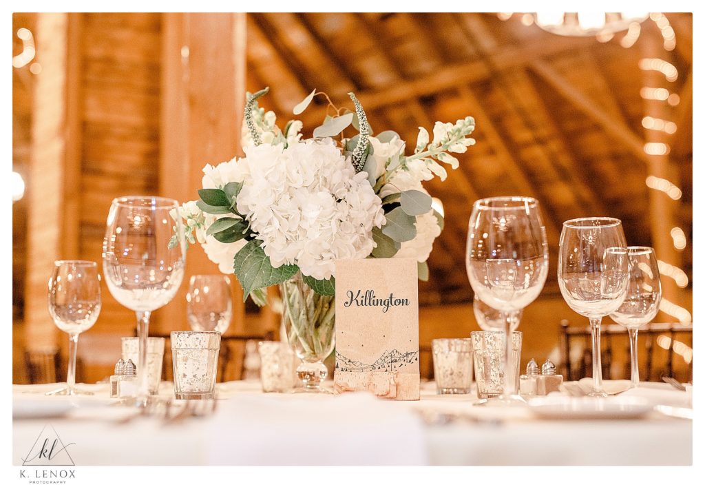 Wedding at Inn at the Round Barn- Reception Decorations Showing table centerpieces of hydrangea, rose, veronica, eucalyptus and garden texture.