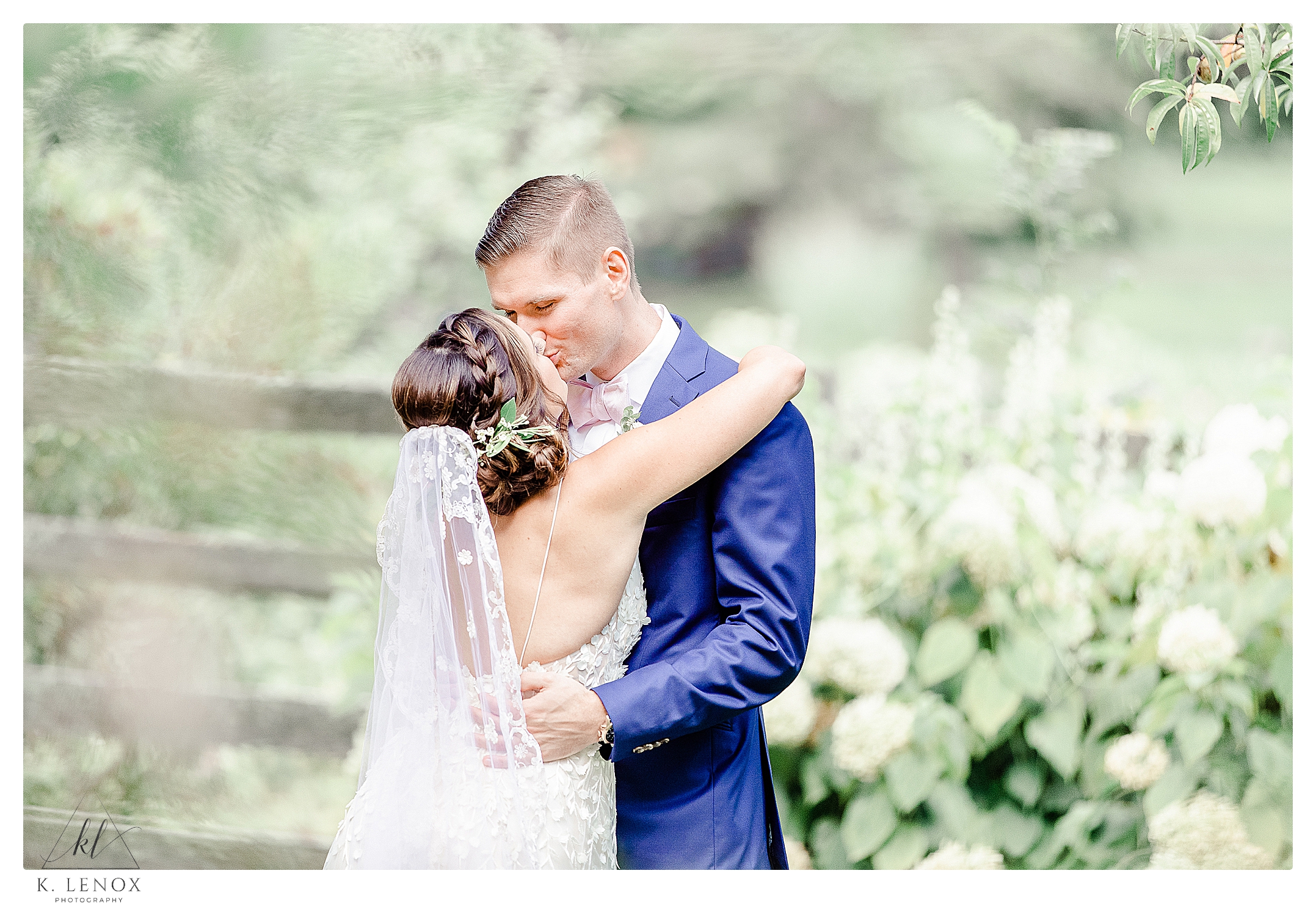 Bride and groom kiss on their wedding at the West Mountain Inn