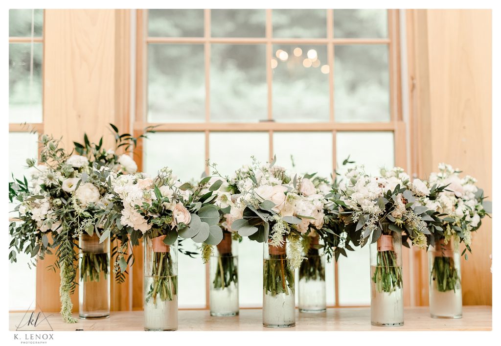 Several floral bouquets lined up on a counter for a Wedding at The West Mountain Inn in Arlington VT. 