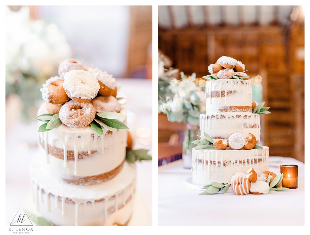 Three tiered naked cake with miniature donuts used as decor. 