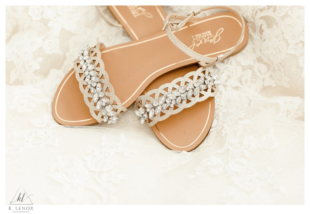 Dressing jeweled wedding shoes that are flat and strappy. 