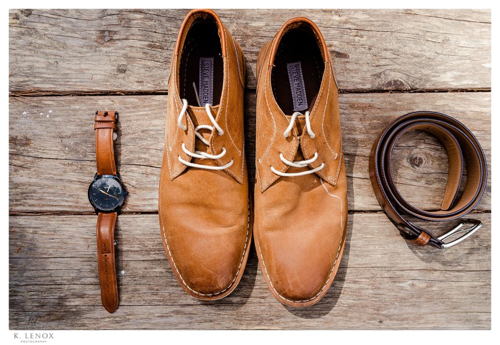 Steve Madden Shoes, Mens with a watch and a leather belt photographed on a wooden porch. 