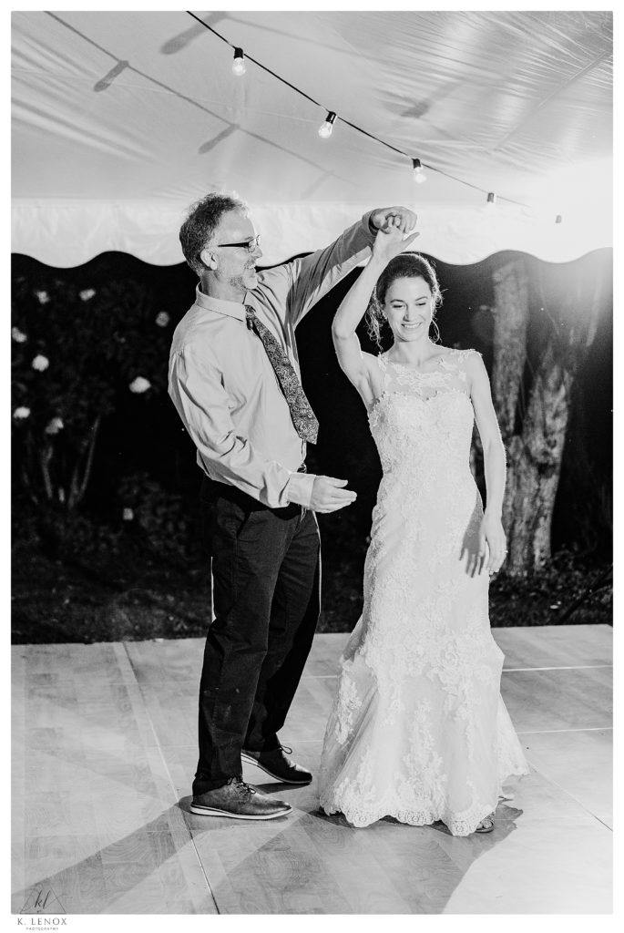 Black and white photo of a Father Daughter dance in Tamworth NH> 