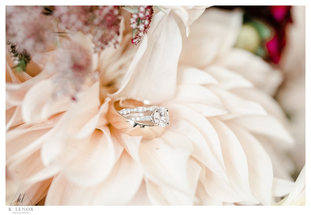 Wedding Rings photographed in a light pink flower. 