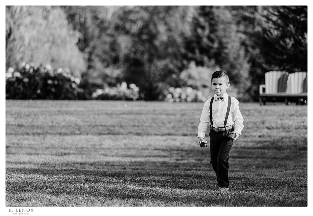 Black and White photo of a ring bearer walking down the aisle for a Wedding at TopKnotch