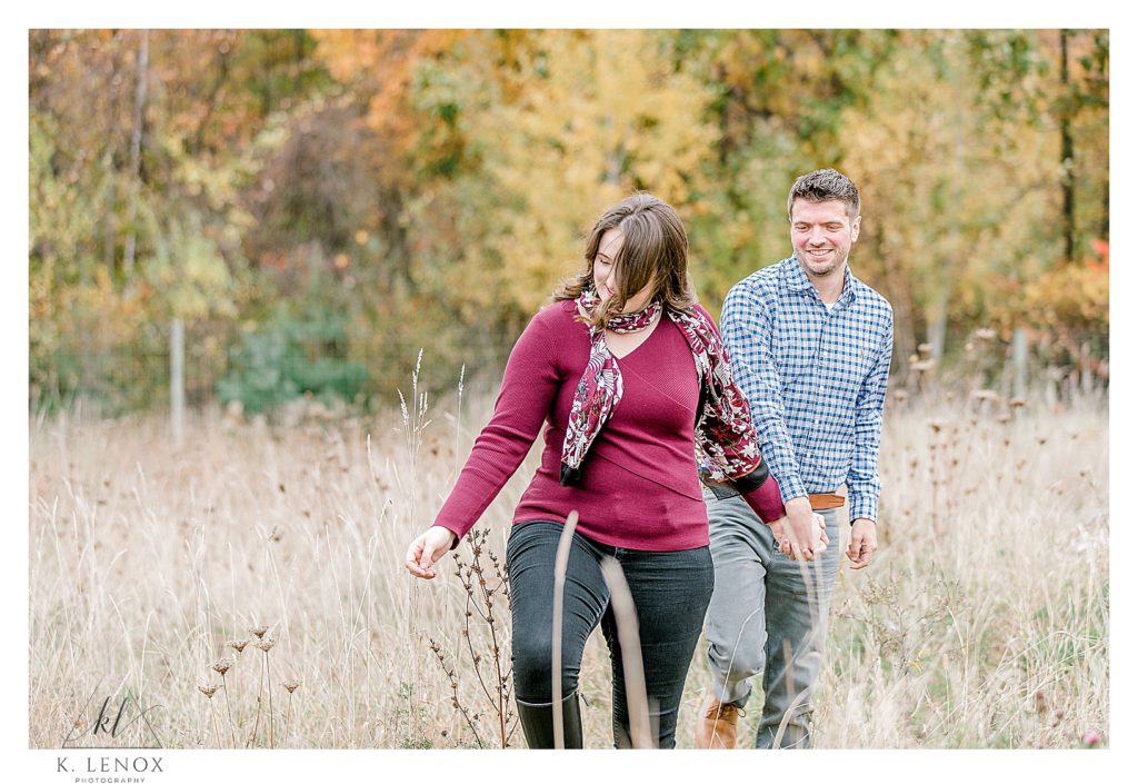 Candid and Natural photo of a couple during their Fall Engagement Session in the Orchard