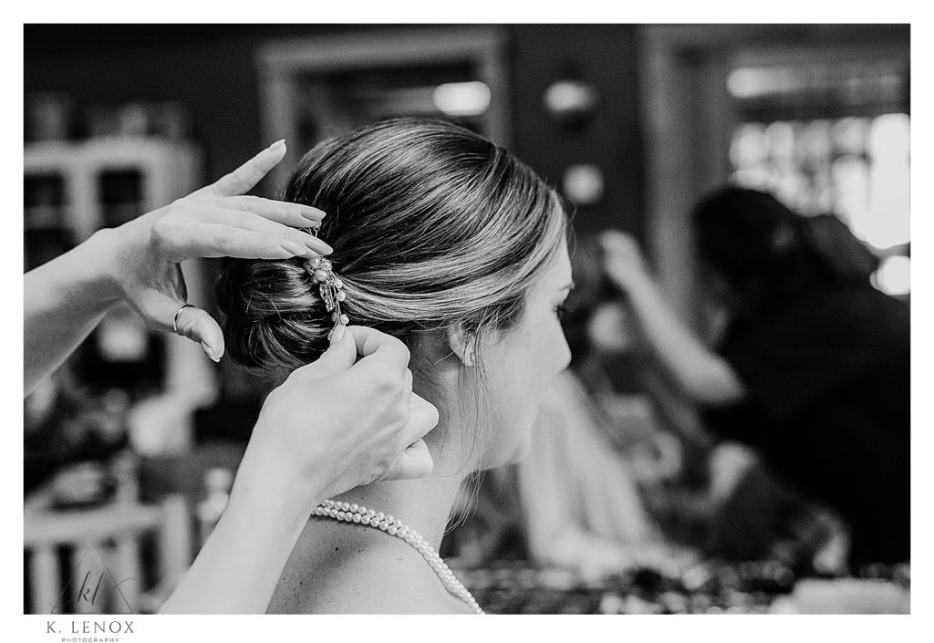 Black and White photo of a bride getting ready on her wedding day. 