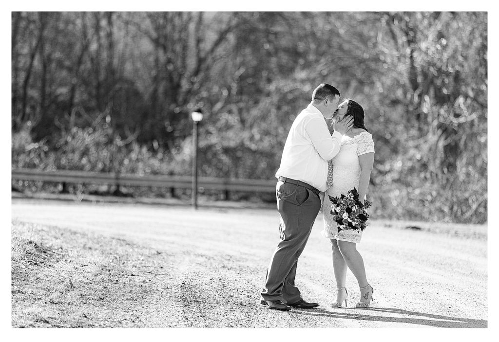 Bride and Groom kiss while going for a walk at the Chesterfield Inn.  During their Covid-19 Elopement. 