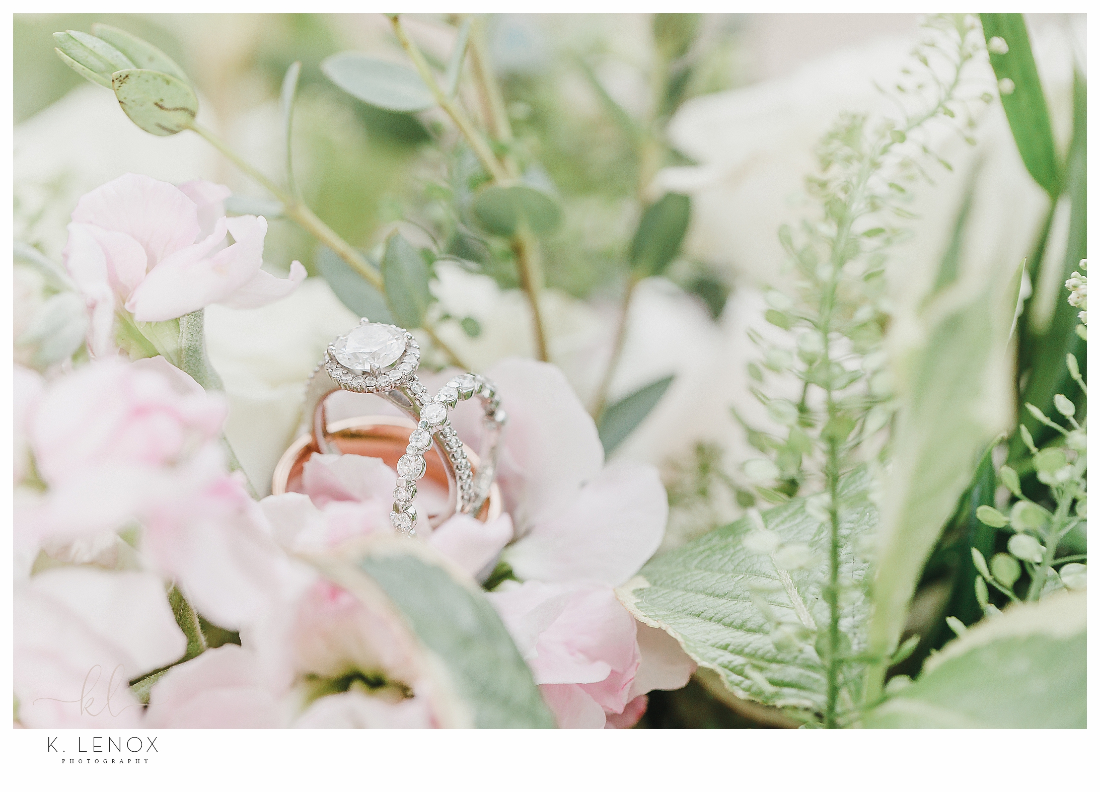 Light and Airy photo of the wedding rings surrounded by flowers. 