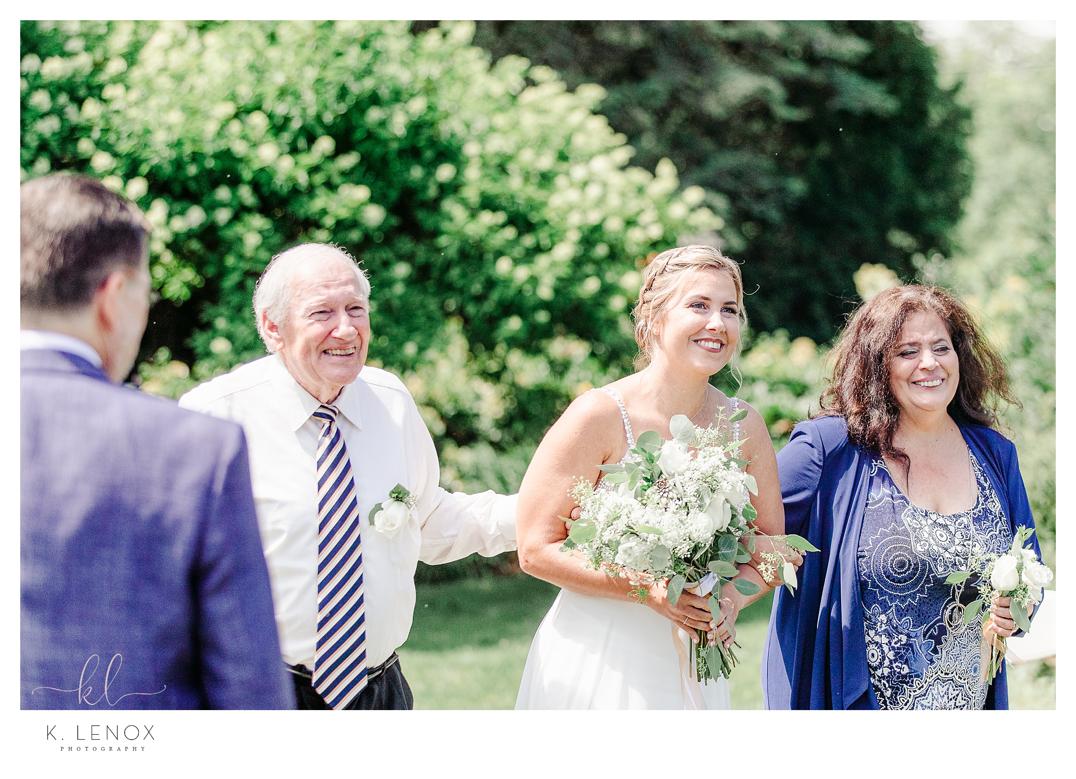 Light and Airy Intimate Wedding at Moran Estates- Bride walks down the aisle with her parents. 