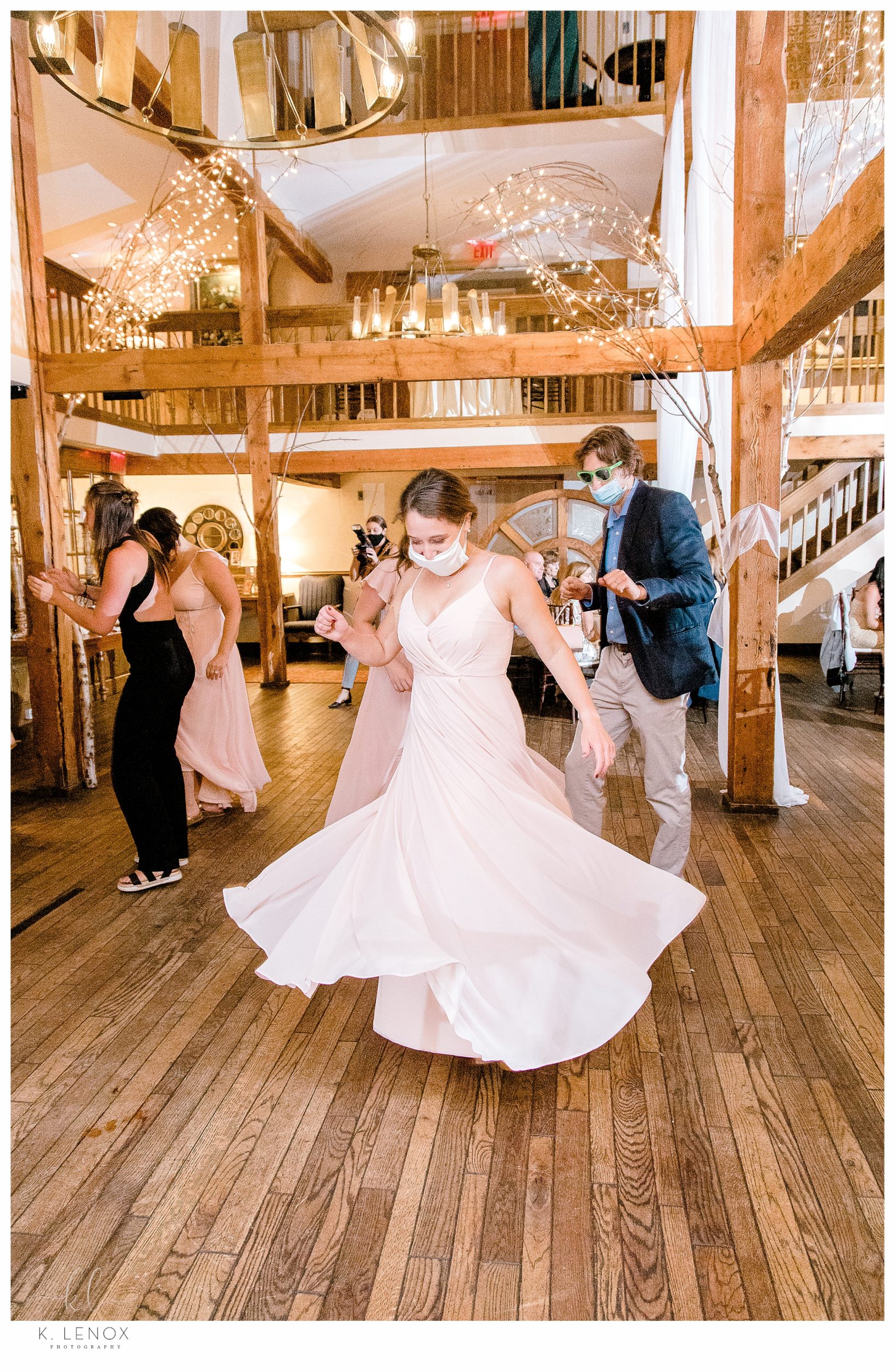 Summer Wedding at the Bedford Village Inn- Bridesmaid dances and twirls her dress. 