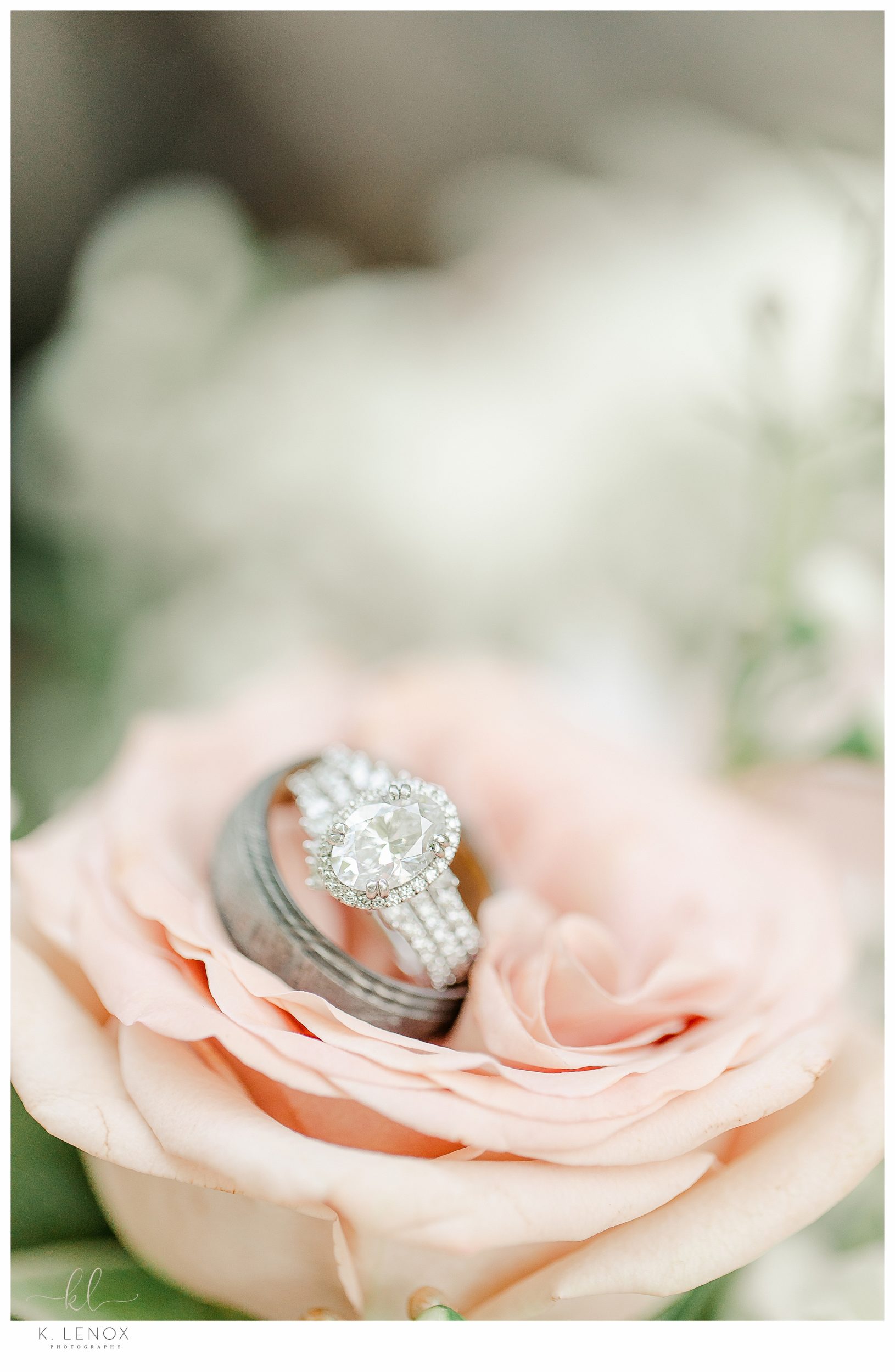 Detail shot from a Wedding planned during the COVID pandemic.  Diamond Ring w/ wedding band ina peach rose. 