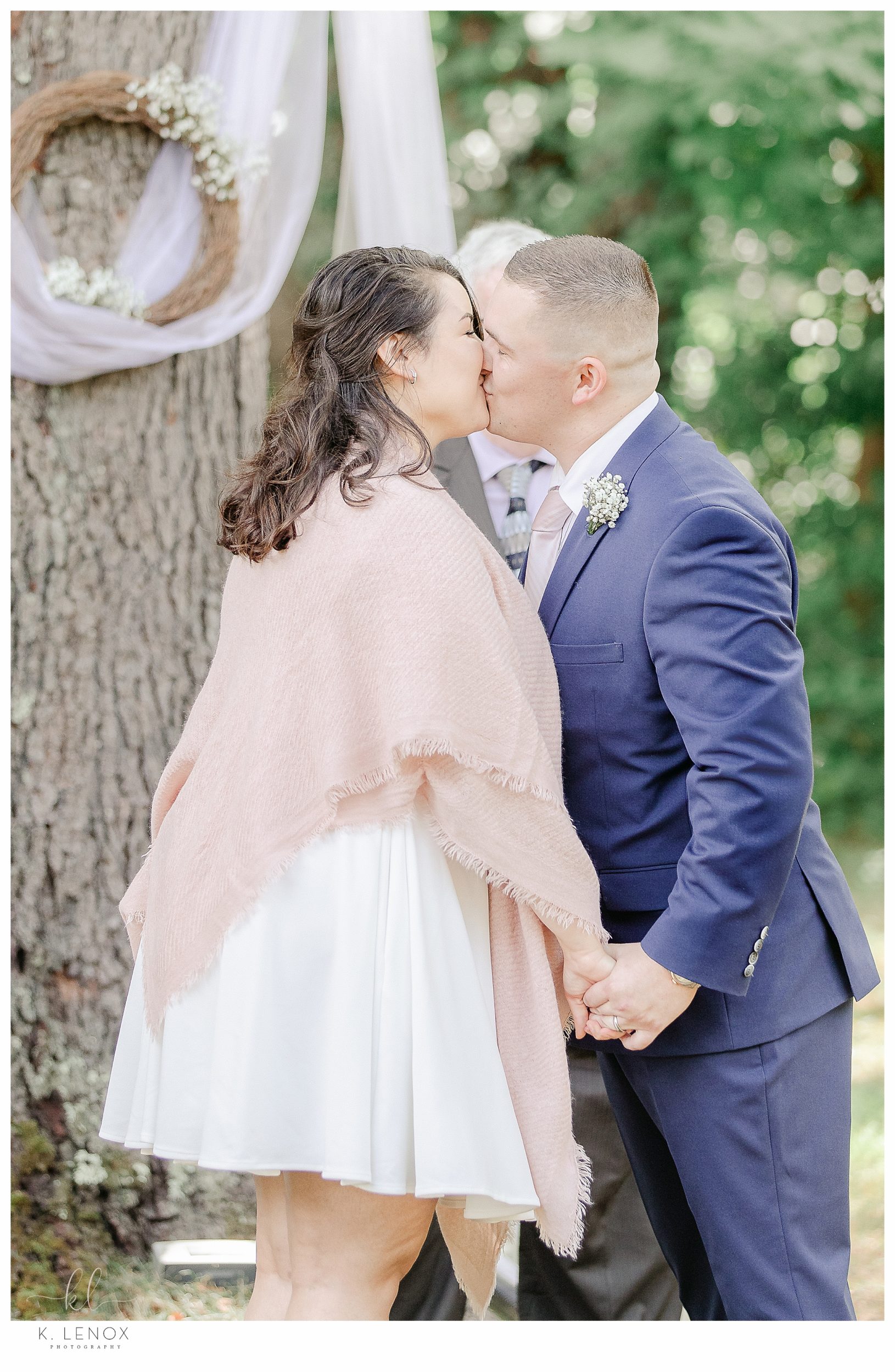 First kiss as husband and wife during their Light and Airy Backyard Elopement. 