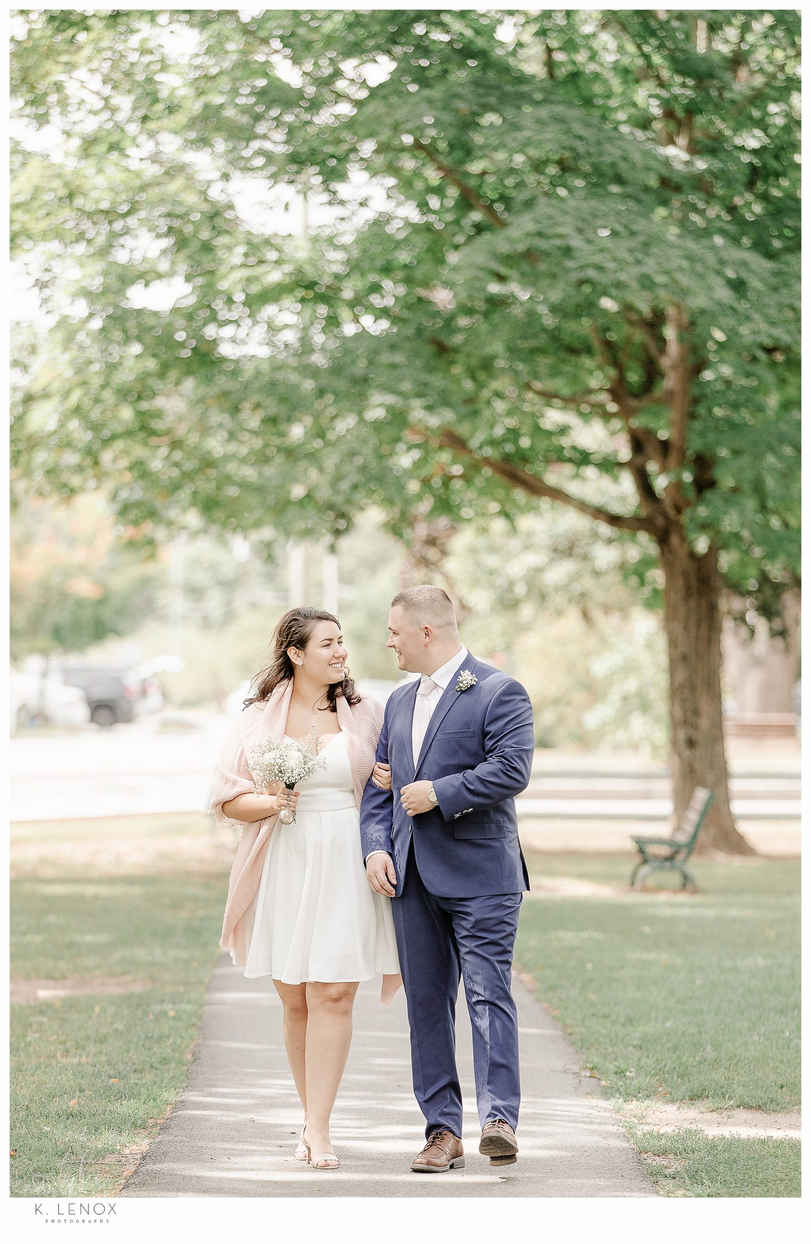 Bride and Groom walking after together after being married at their sweet and simple backyard elopement. 