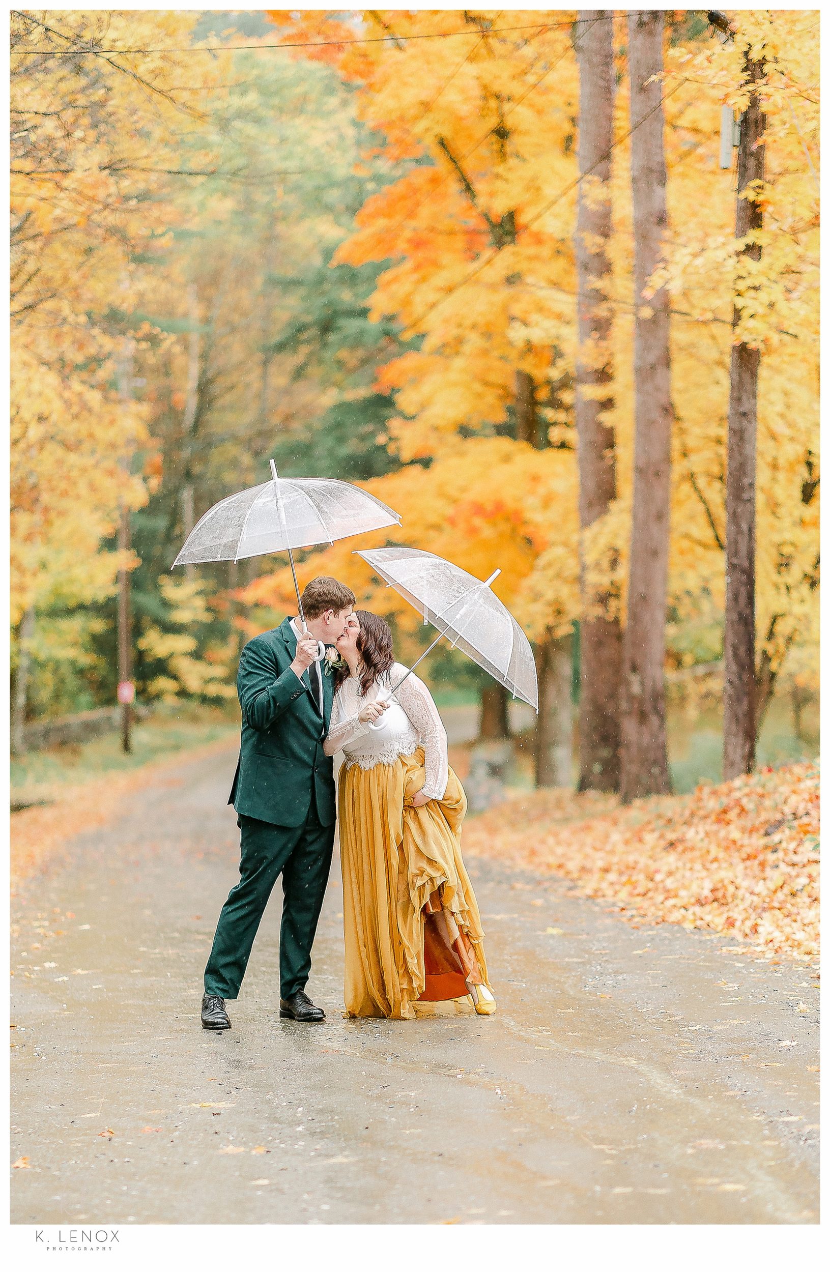 Fall MicroWedding at Moran Estates,  Bride and Groom kissing on a mountain road in the rain