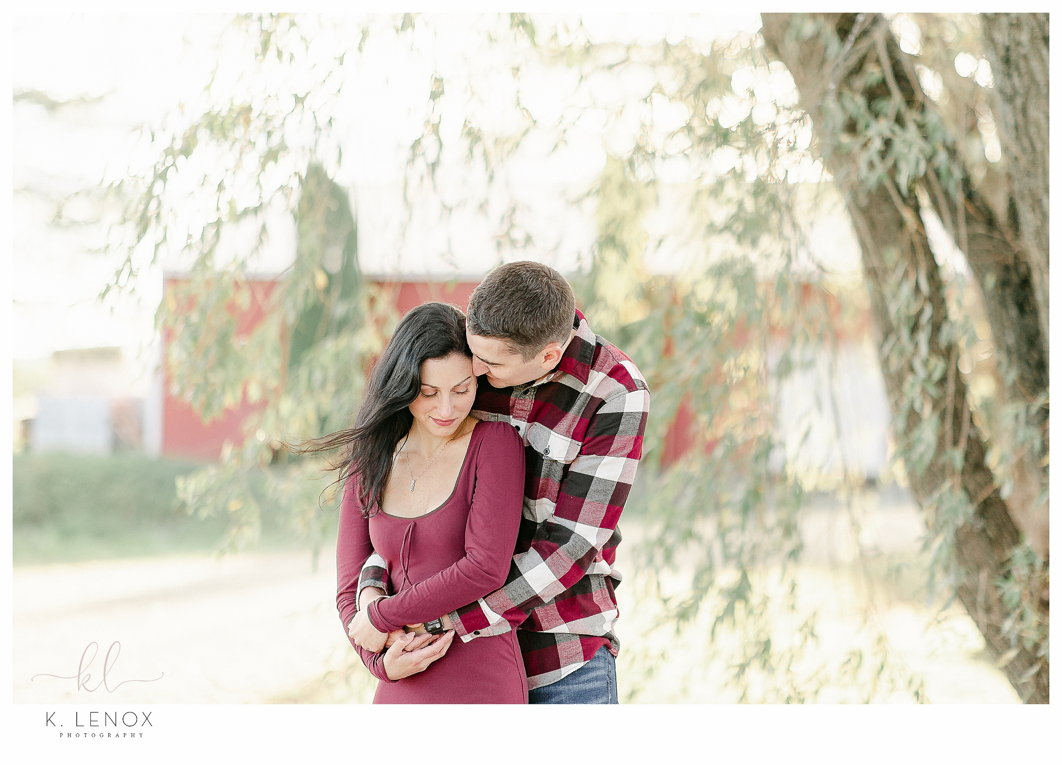 Fun and Carefree Engagement Session in NH- Light and Airy photo of a man hugging his fiance