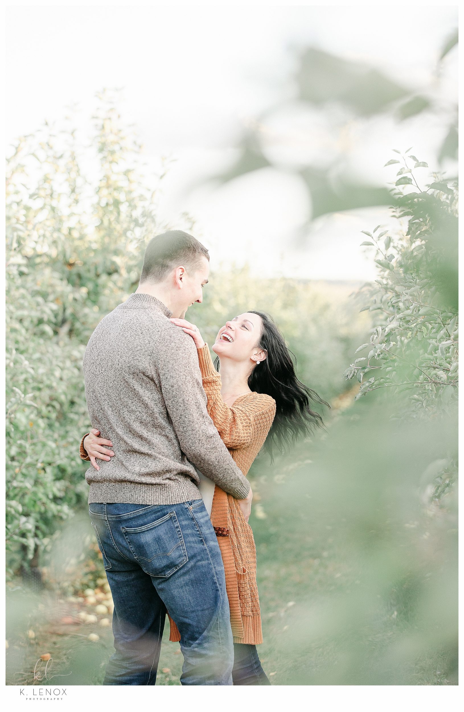 Fun and Carefree Engagement Session in NH- Man and Woman Laughing. 