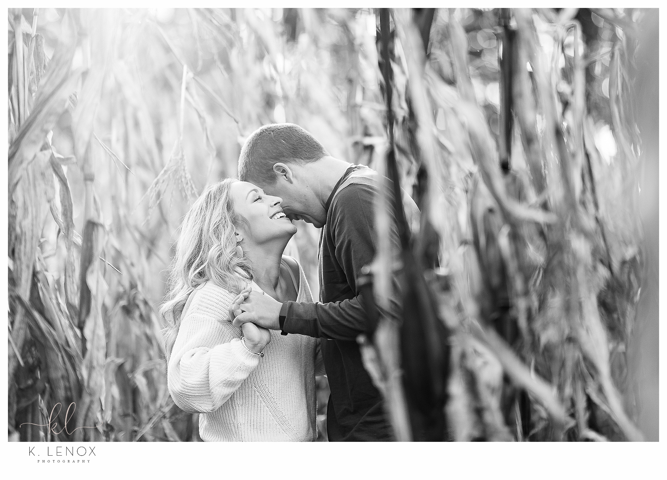Light and Airy Engagement Session at Riverview Farm-Photo of a man and woman in the corn stalks