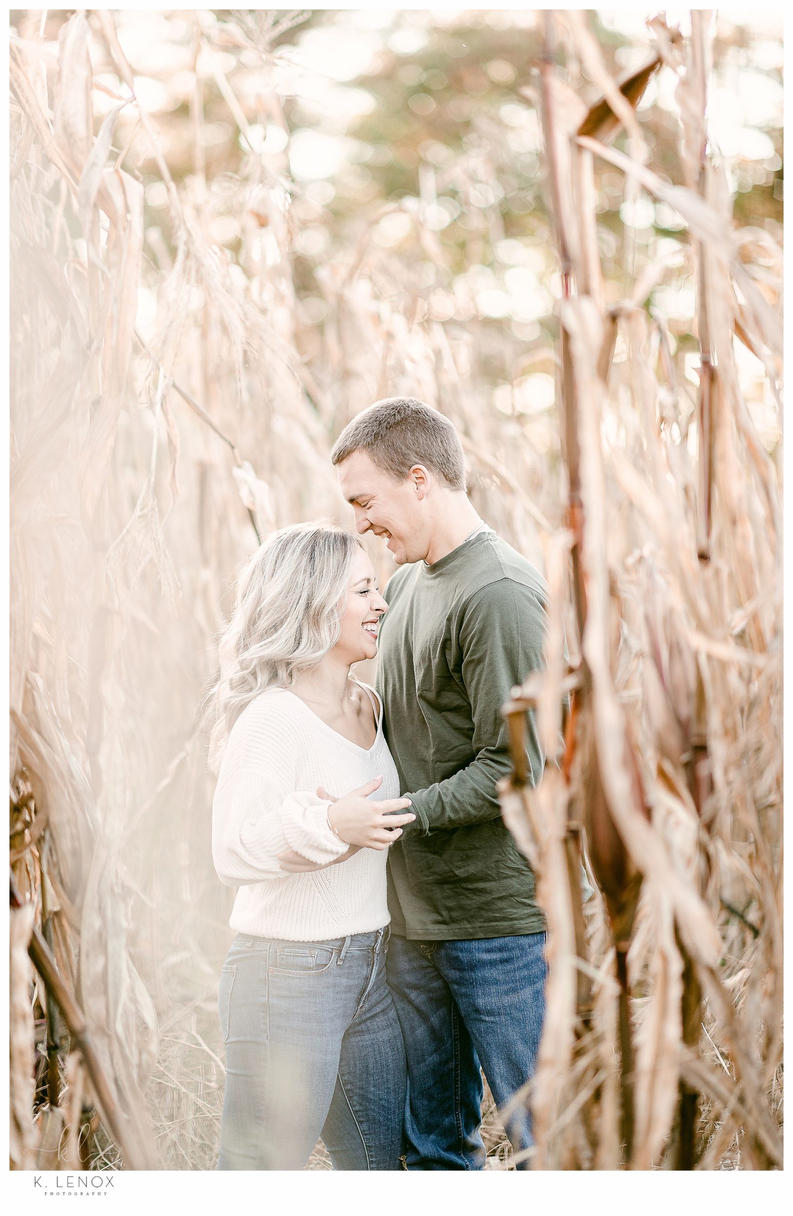 Light and Airy Engagement Session at Riverview Farm-Photo of a man and woman in the corn stalks