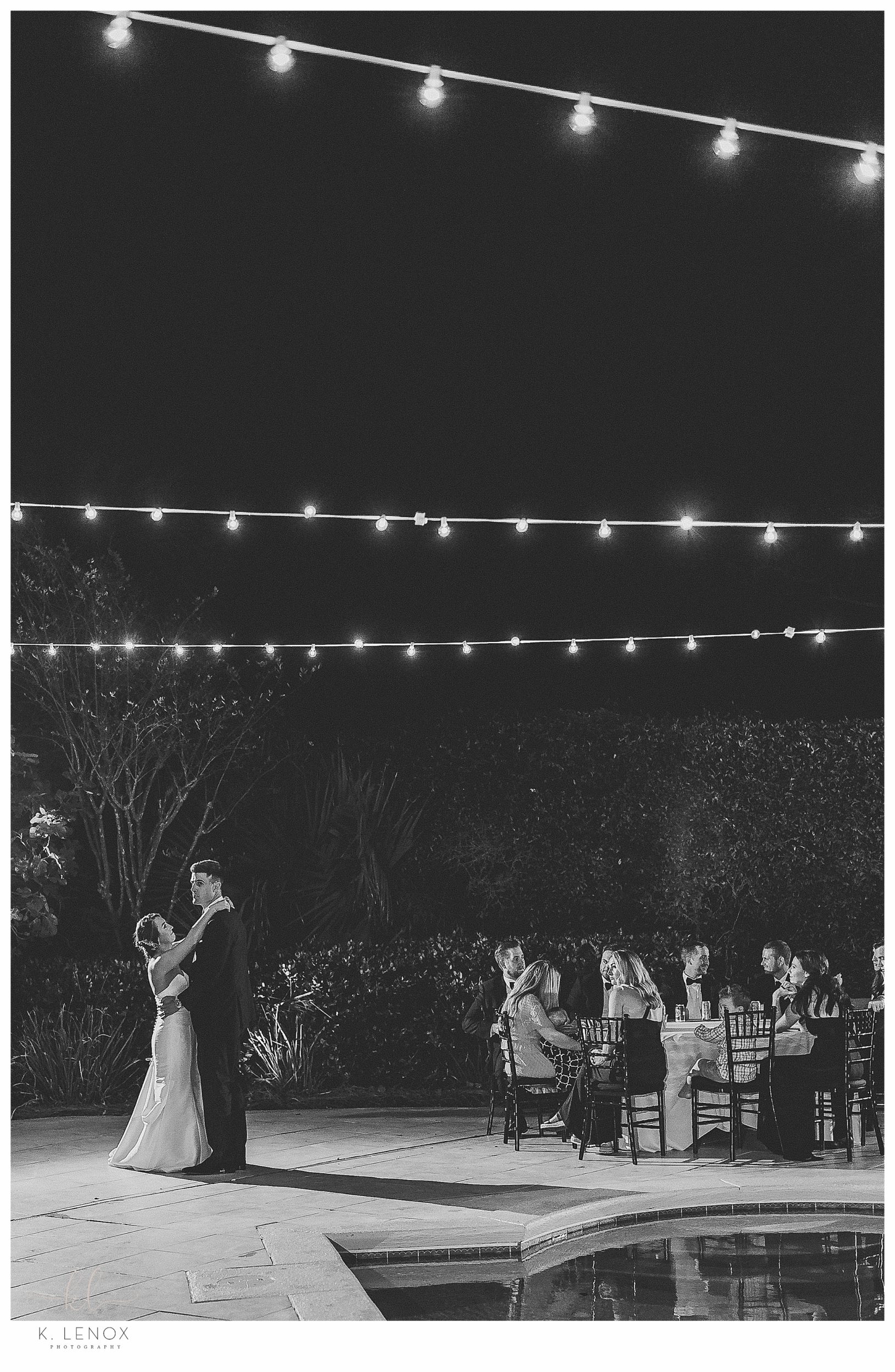Black Tie Beach Wedding on Hilton Head- Black and White photo of the couples first dance next to the pool. 