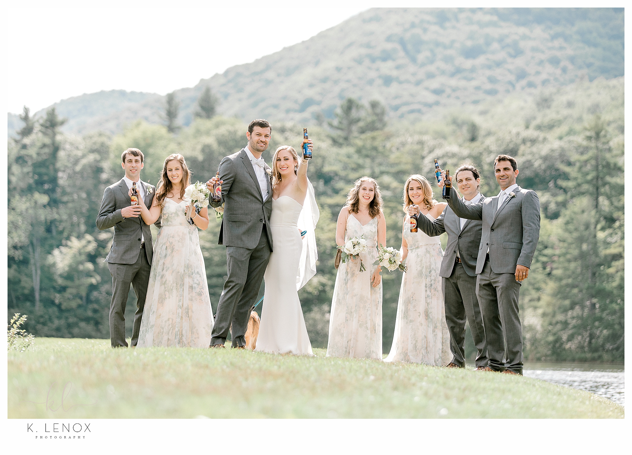 Wedding Party Cheers as they walk near the Pond Pavilion, at the Equinox Resort in VT