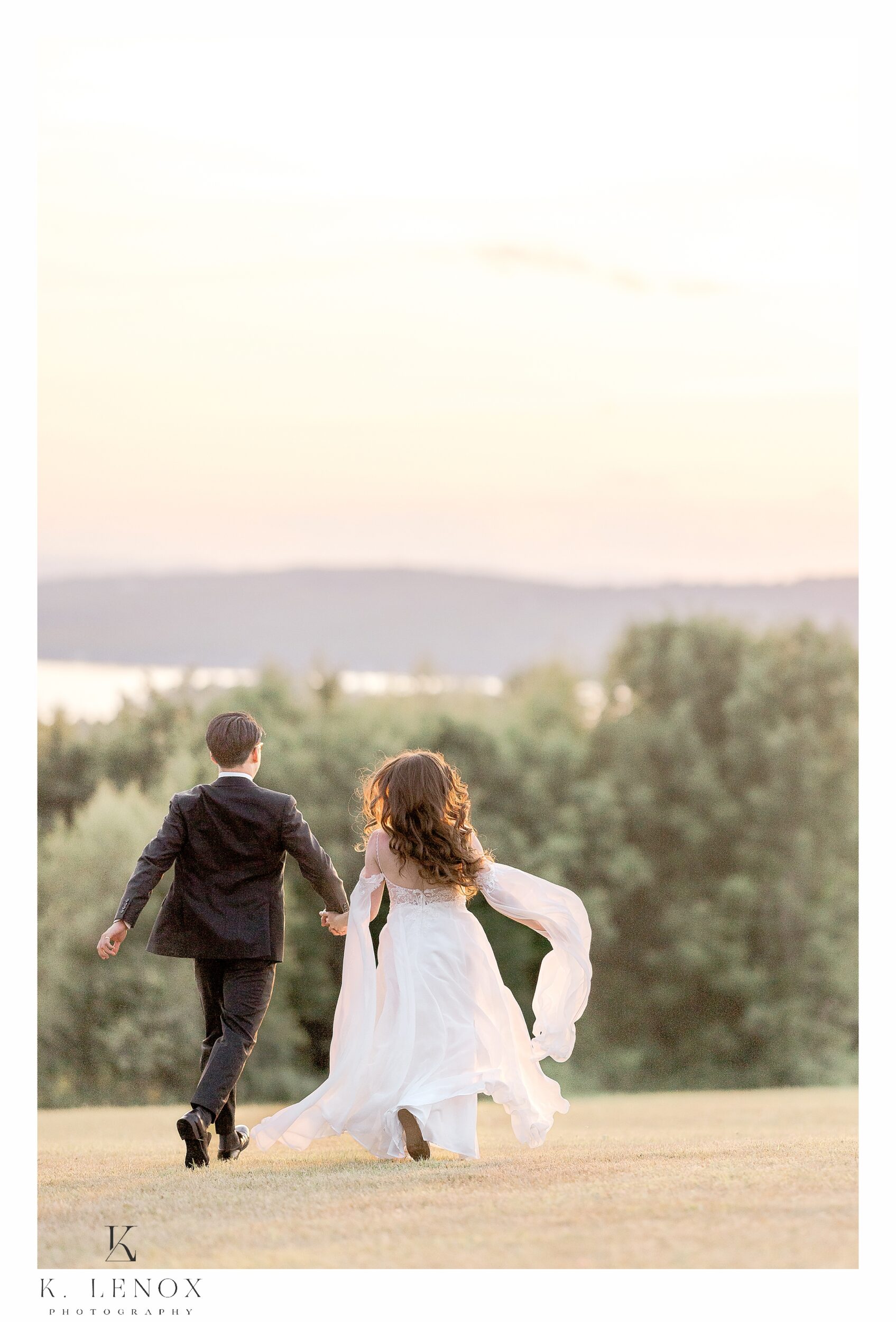 Bride and Groom running into the sunset at a Wedding in Wolfeboro NH at the lakeview inn